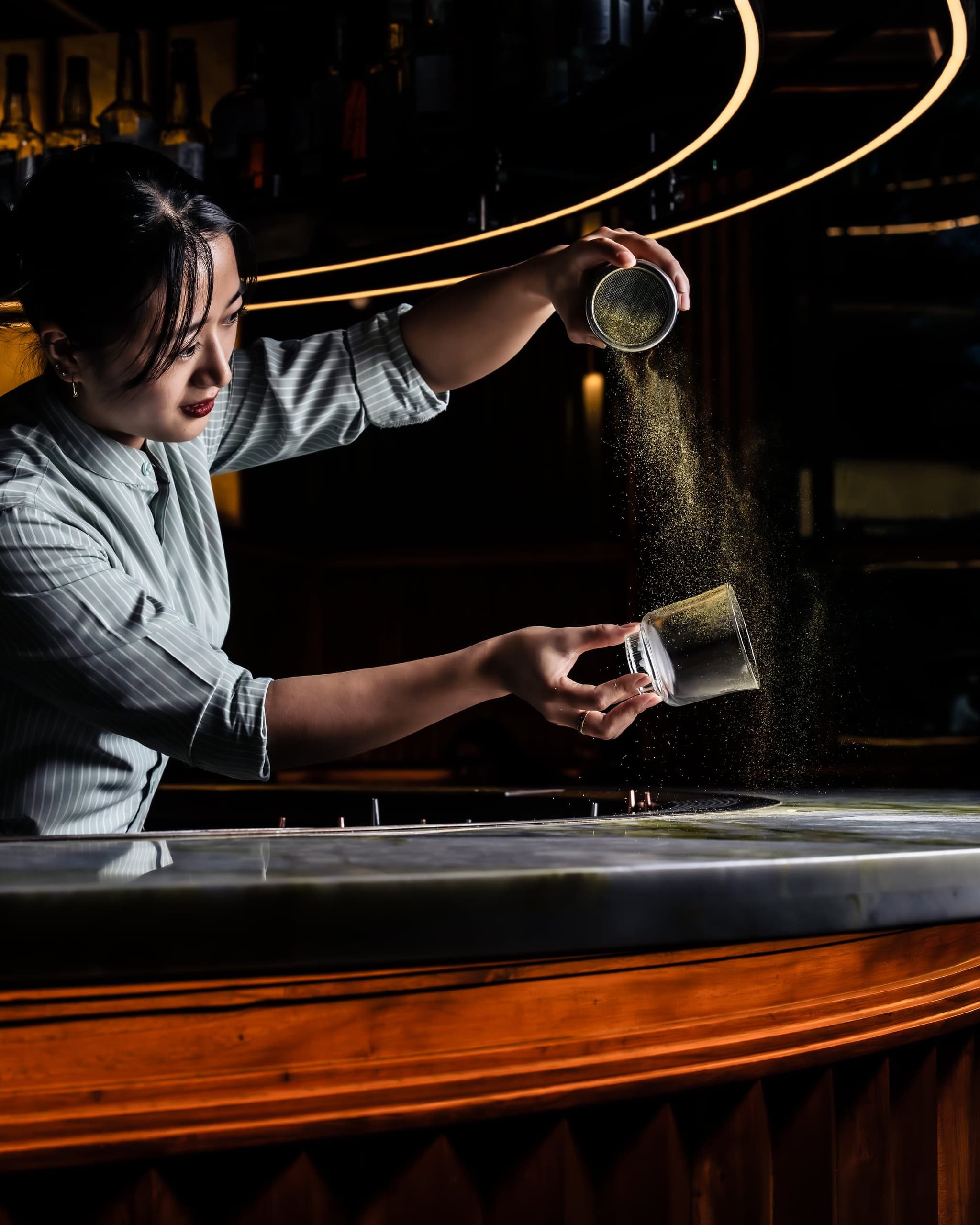A MURO bartender dusting a cocktail at the bar